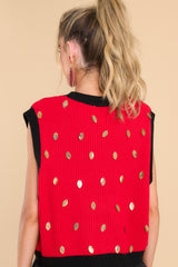 Back view of this sweater vest that features a crew neckline, shiny football sequins, 