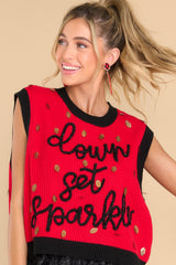Front view of this sweater vest that features a crew neckline, shiny football sequins, 
