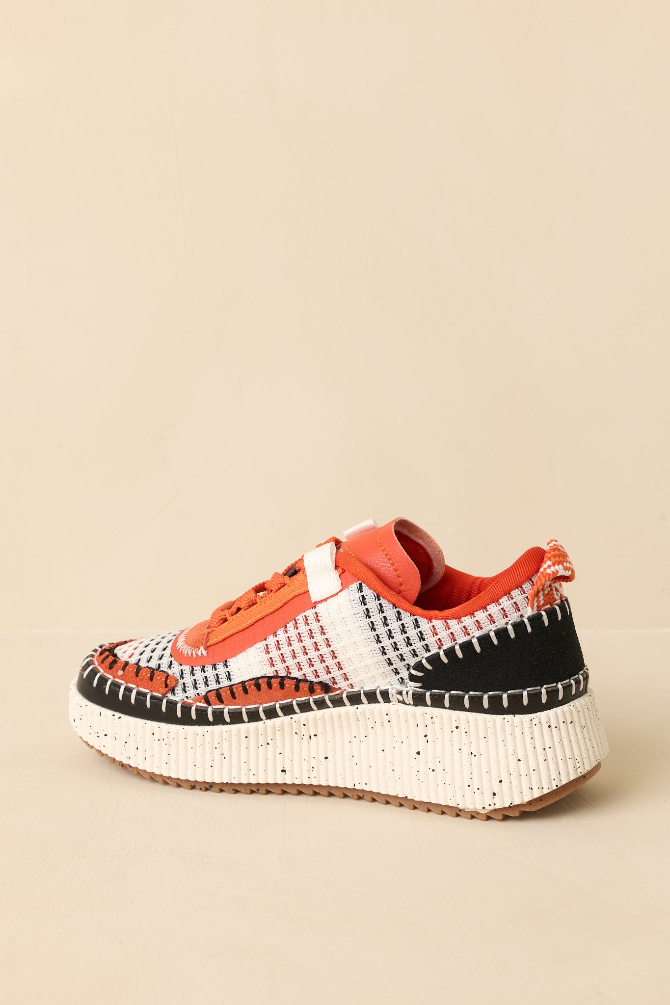 Back view of the platform sneakers highlighting the padded heel collar and textured rubber outsole.