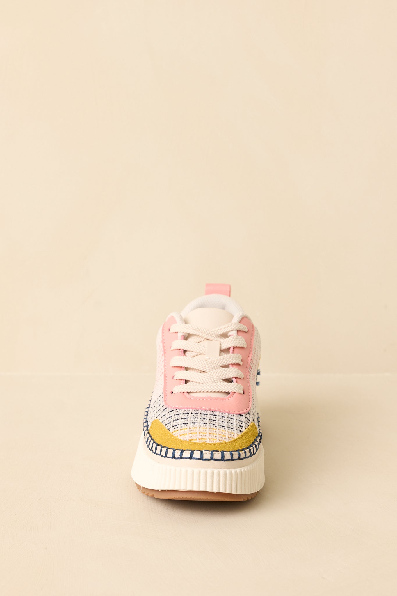 Pink multi sneakers showing the toe shape, knit texture, and clean lace arrangement.