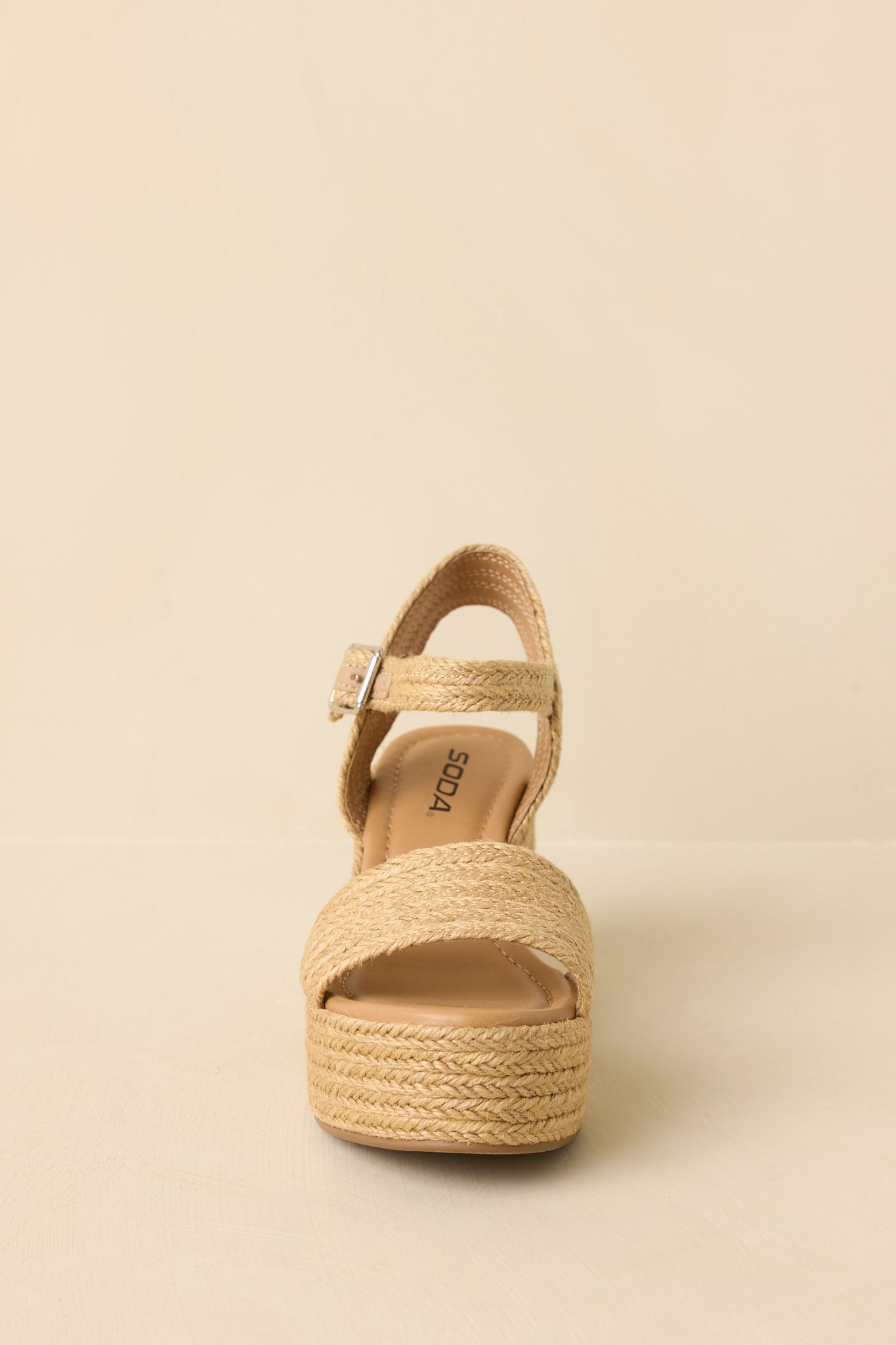 Sandals displayed to show the cushioned footbed, open-toe design, and clean platform sole.