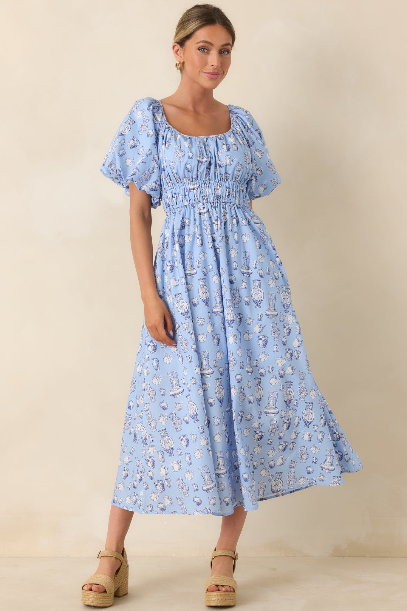 Lightweight midi dress with side pockets, delicate pottery illustrations, and airy fit.