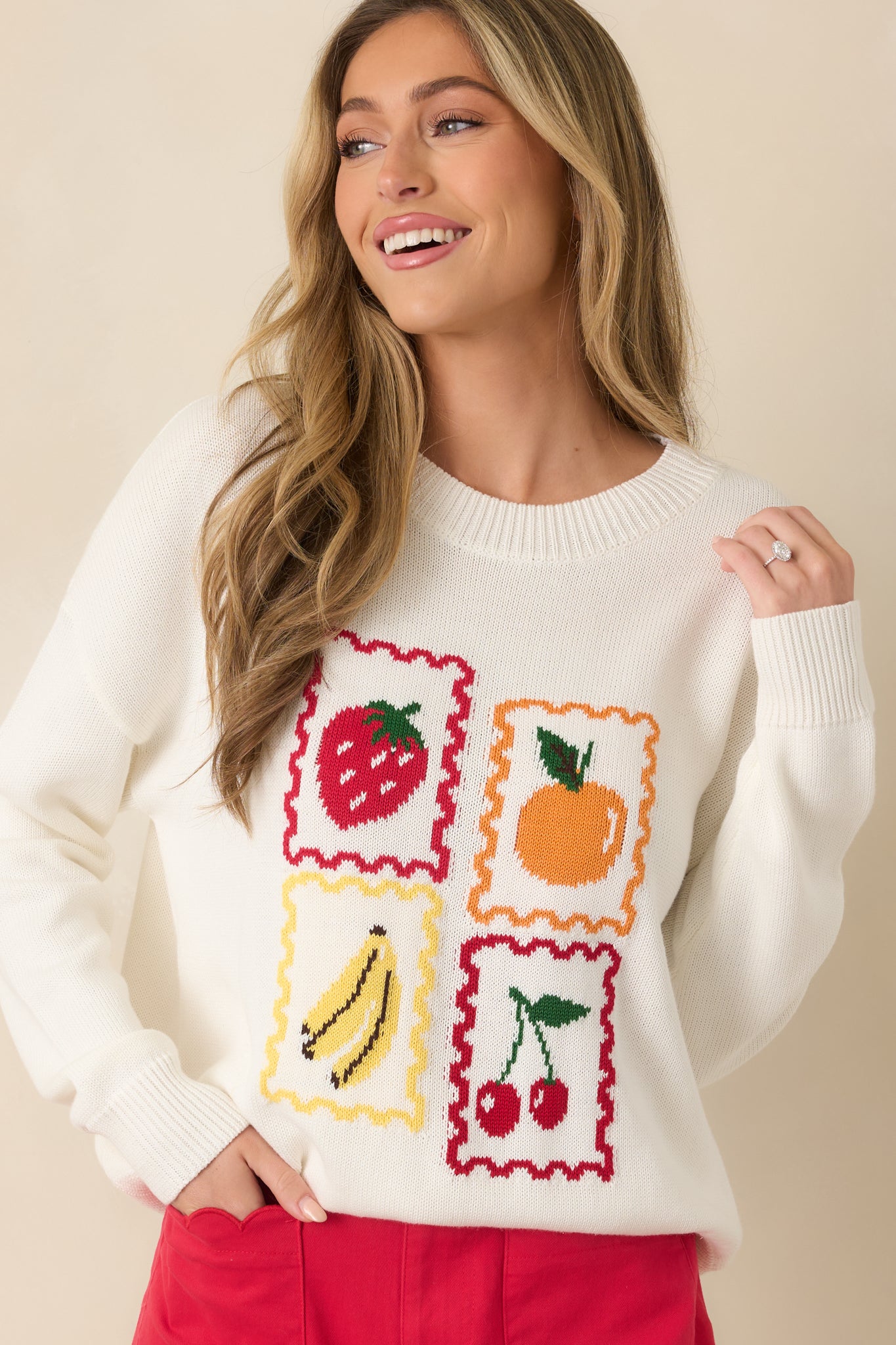 Focused view of whimsical fruit graphics with vintage-style scalloped borders.