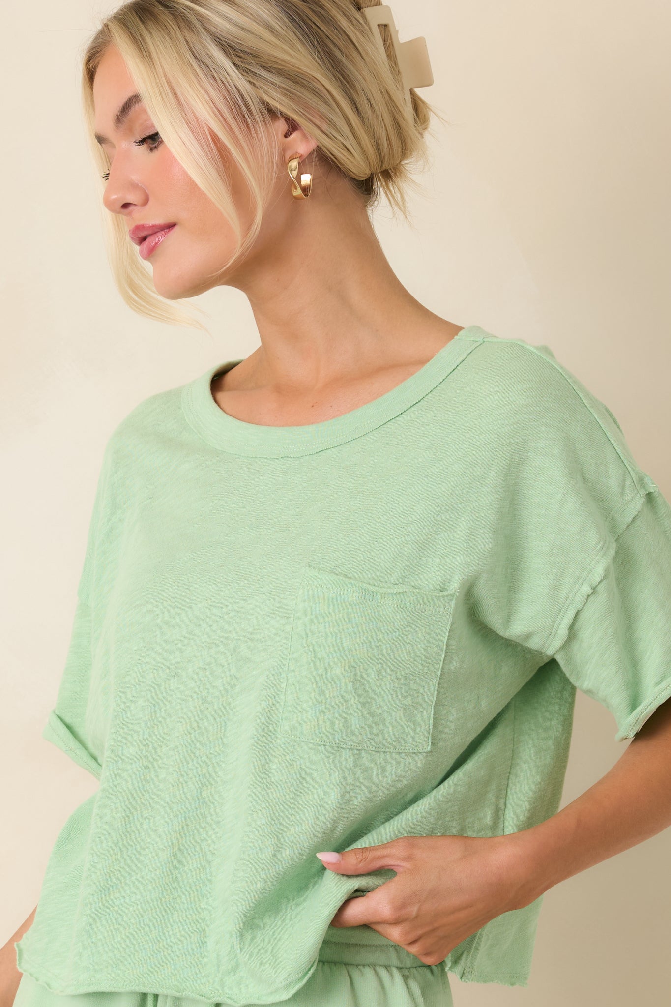 Relaxed fit tee with short sleeves and slightly cropped modern length.