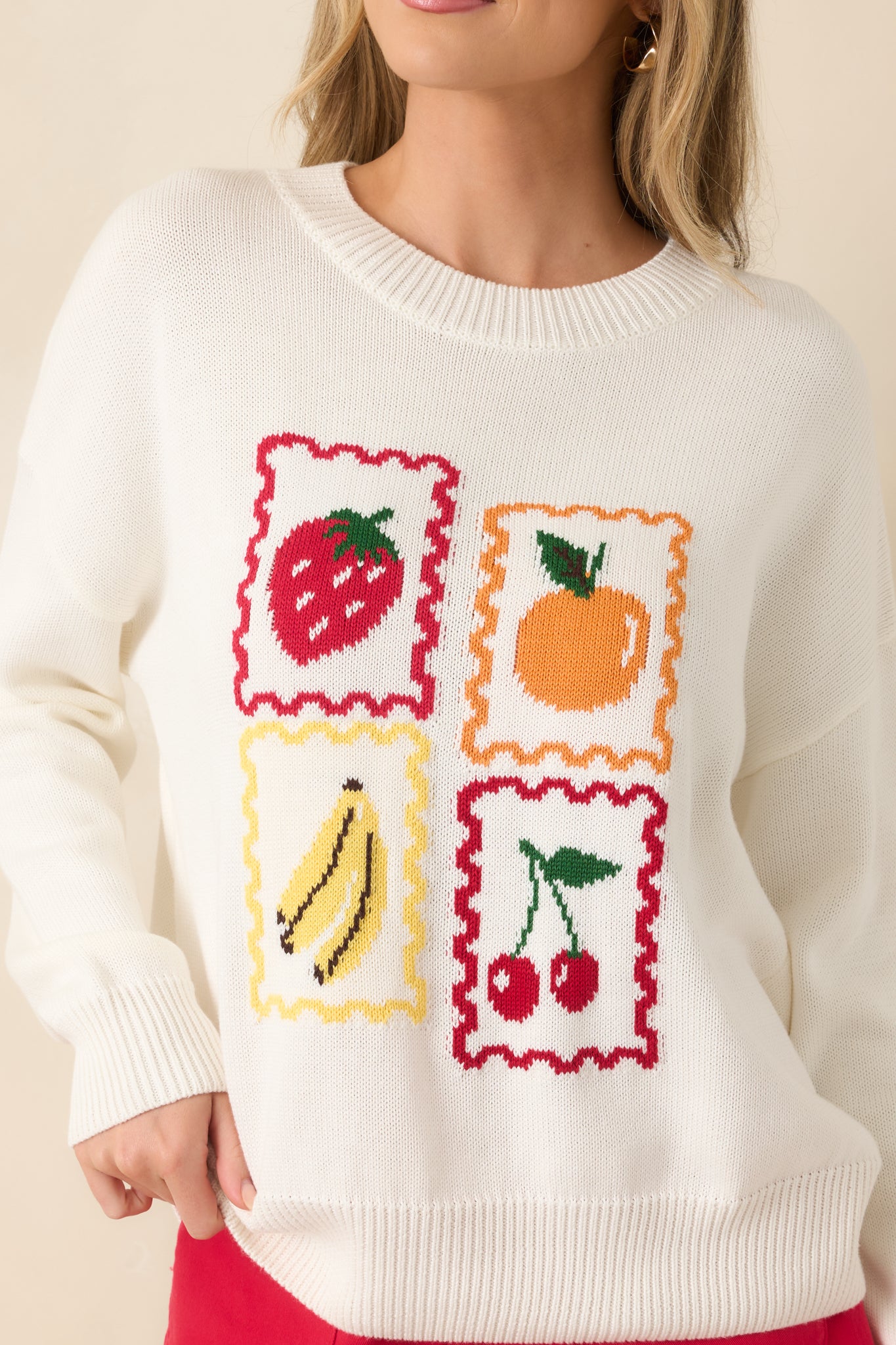 Intricate fruit stamp graphic featuring scalloped framing and vibrant multicolor detailing.
