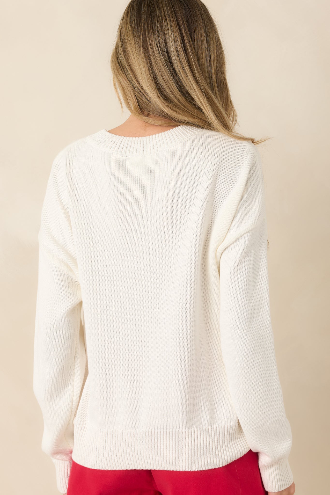 Rear view of the pullover showing a clean, relaxed silhouette with a soft, cozy finish.

