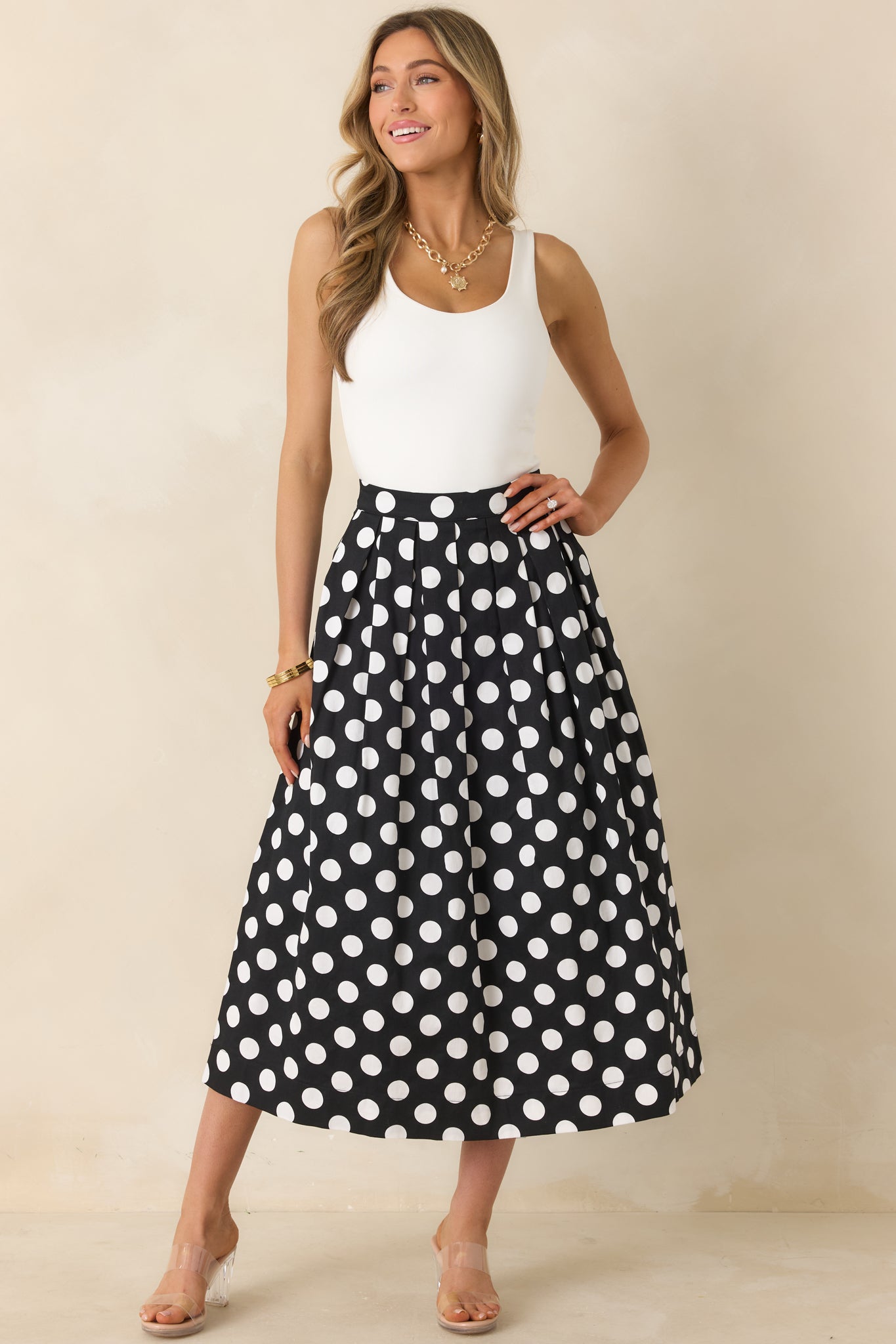 Full view of black and white skirt highlighting the pleated shape and airy A-line movement.