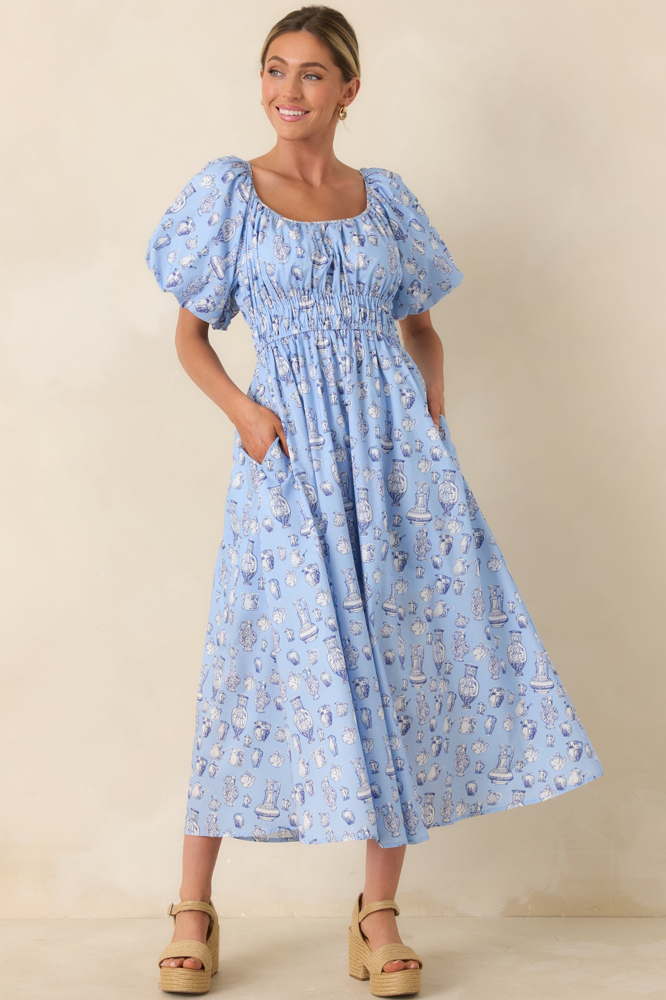 Easy midi-length dress with gathered neckline, breathable fabric, and playful print.