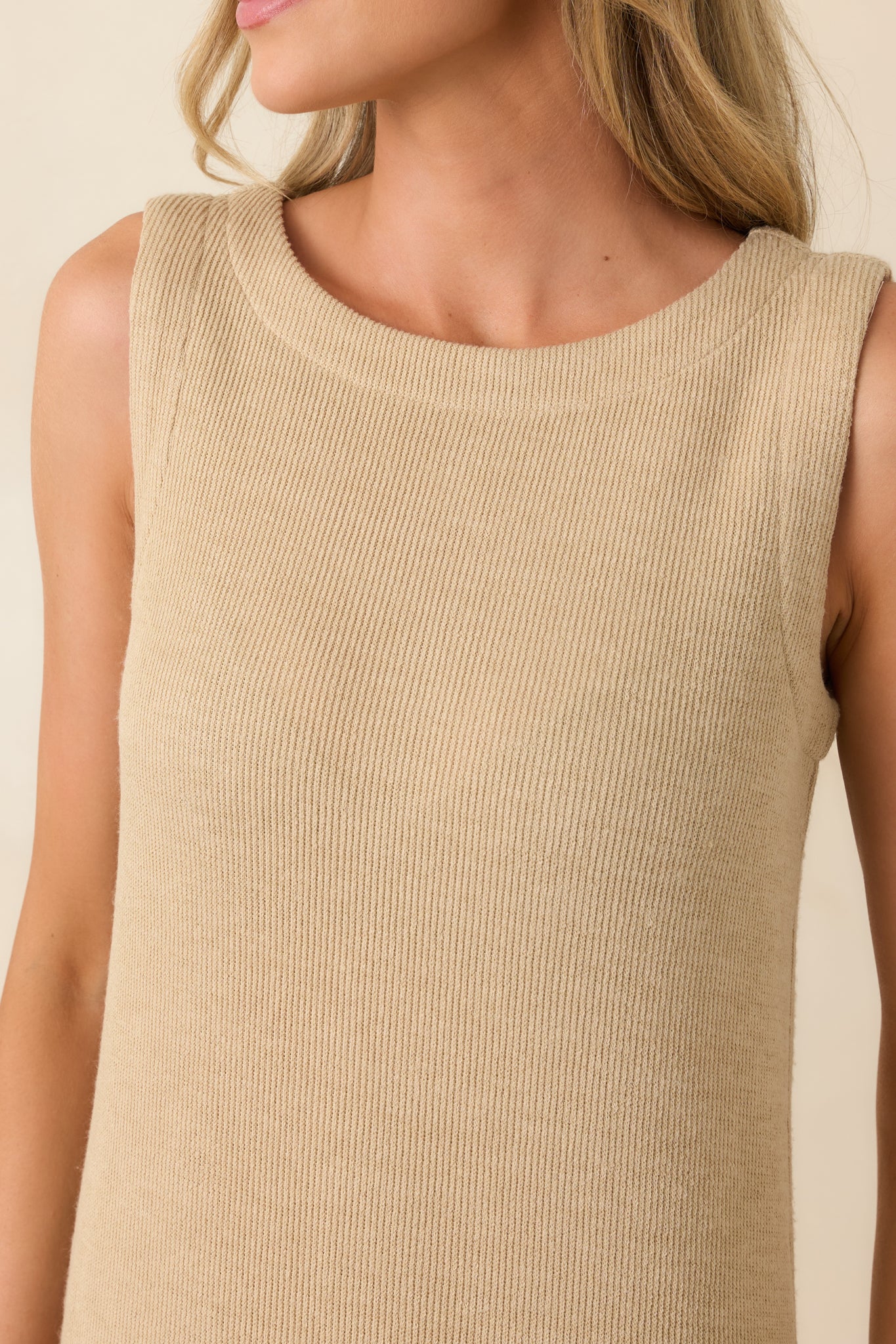 Detailed view of the natural midi dress highlighting the rib knit fabric and rounded neckline finish.