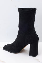 Inside view of black booties with a functional zipper down the back, and 