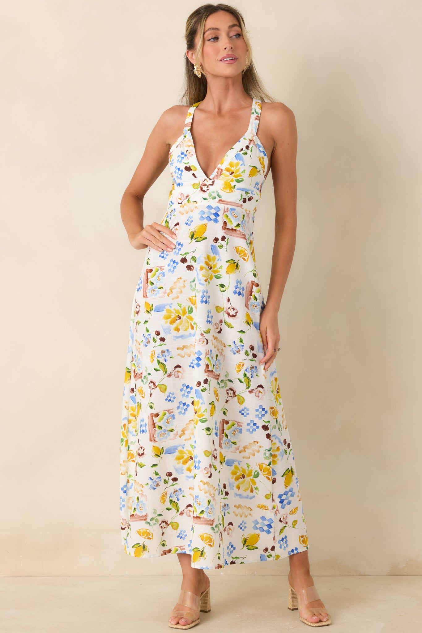 Citrus-inspired midi dress with floral accents and graceful, full skirt silhouette.