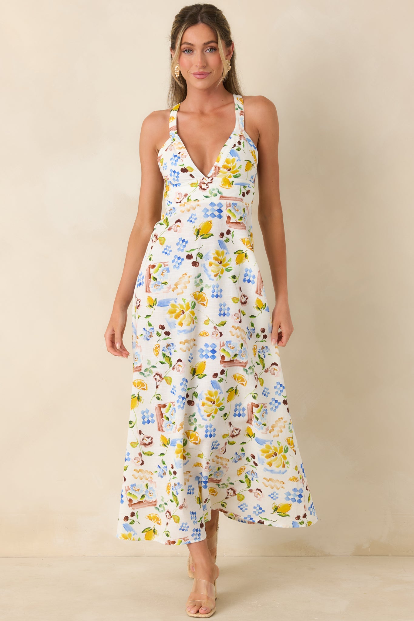 Multi-print dress with V-neckline and lightweight, flowing movement through the skirt.