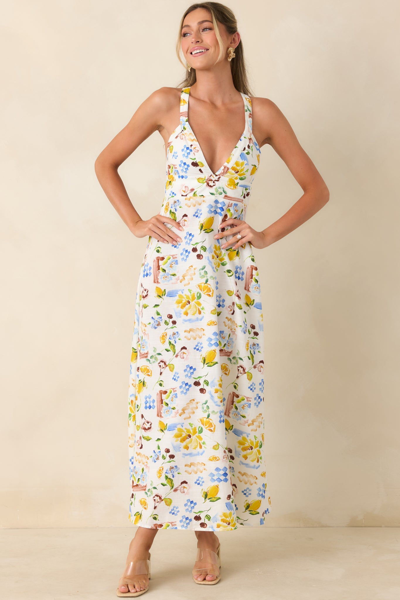 Vibrant printed dress featuring hand-painted tile details and a softly structured bodice.