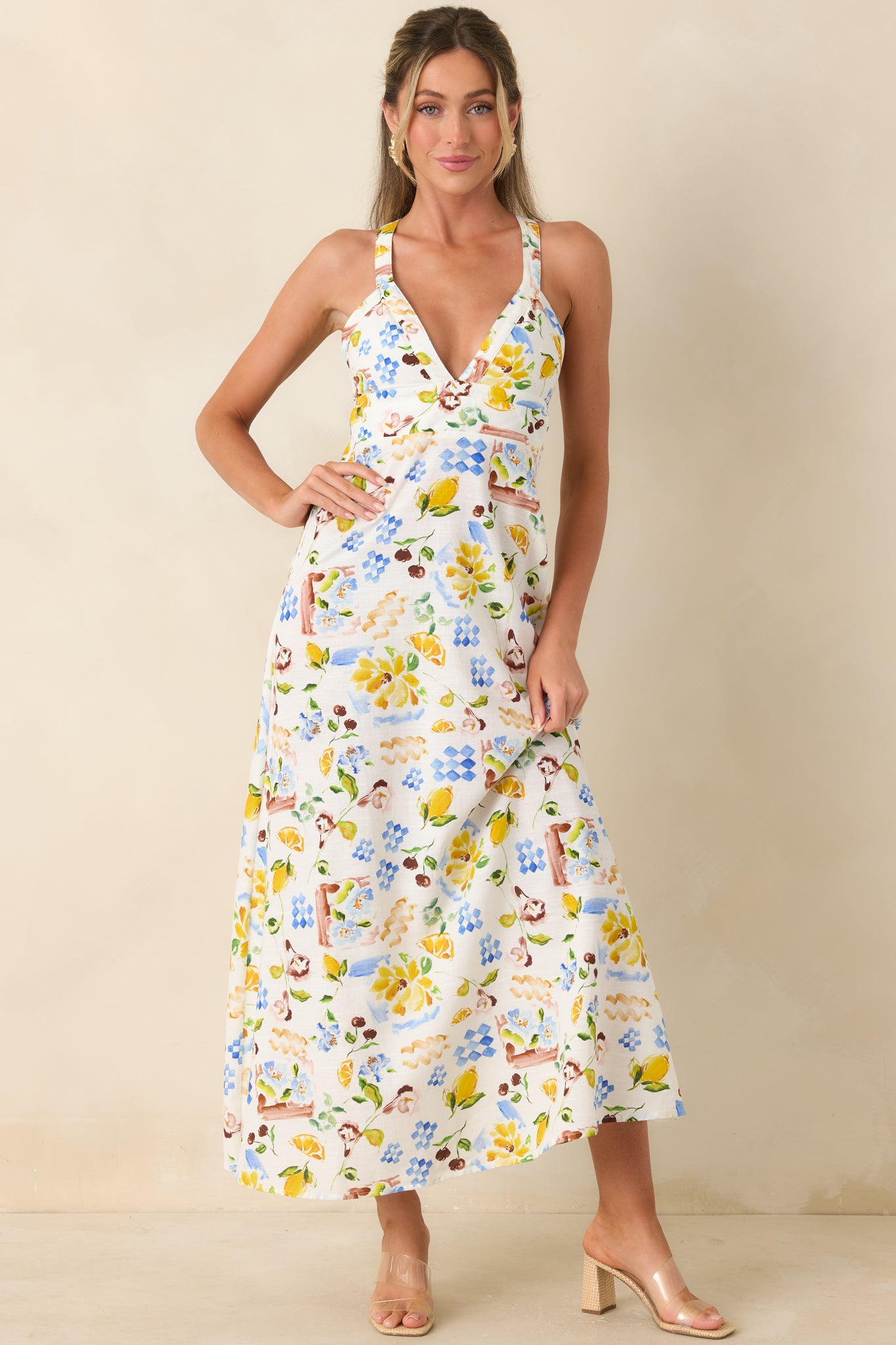 Playful citrus and floral midi dress with a flattering, structured bodice and airy drape.