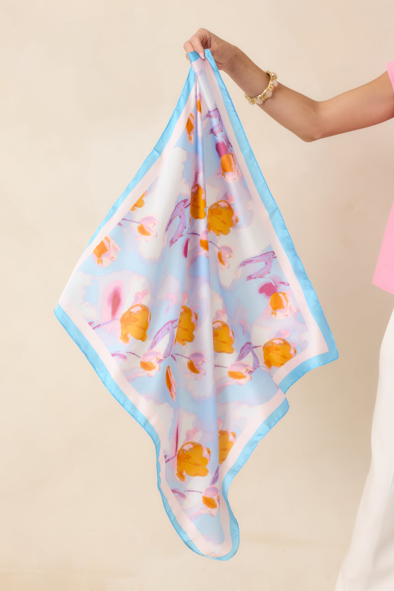 Colorful floral scarf showcasing the full dreamy watercolor print with delicate blooms and a versatile accessory design.