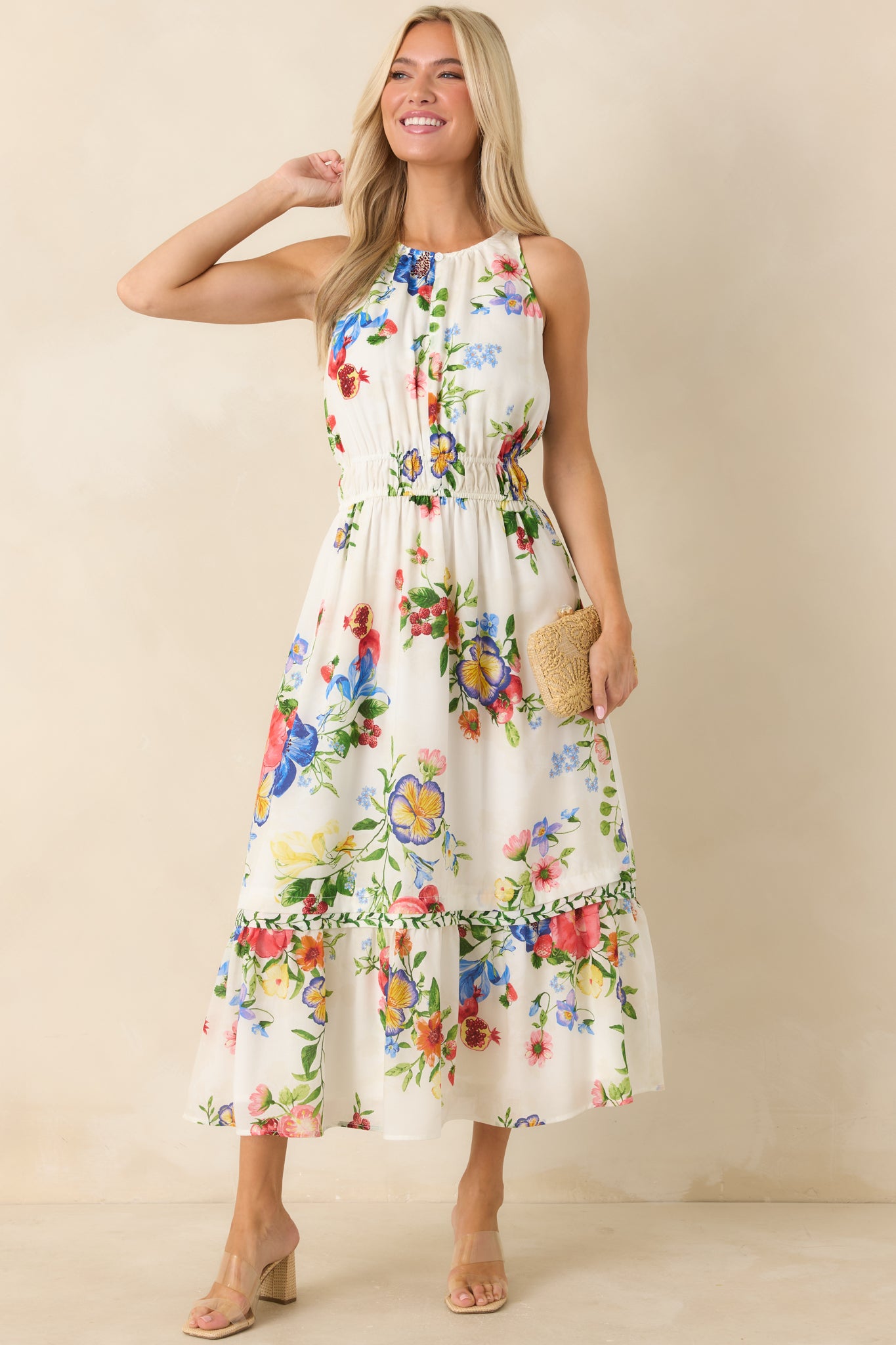Garden-fresh print midi dress featuring elastic waistband and tiered hem silhouette.