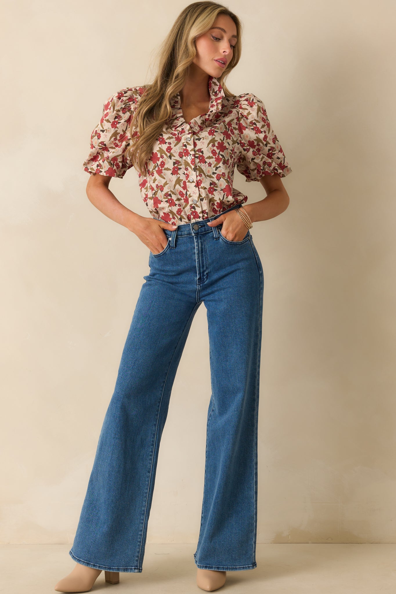 A front-facing image of the floral puff sleeve top highlighting its slightly structured fit.