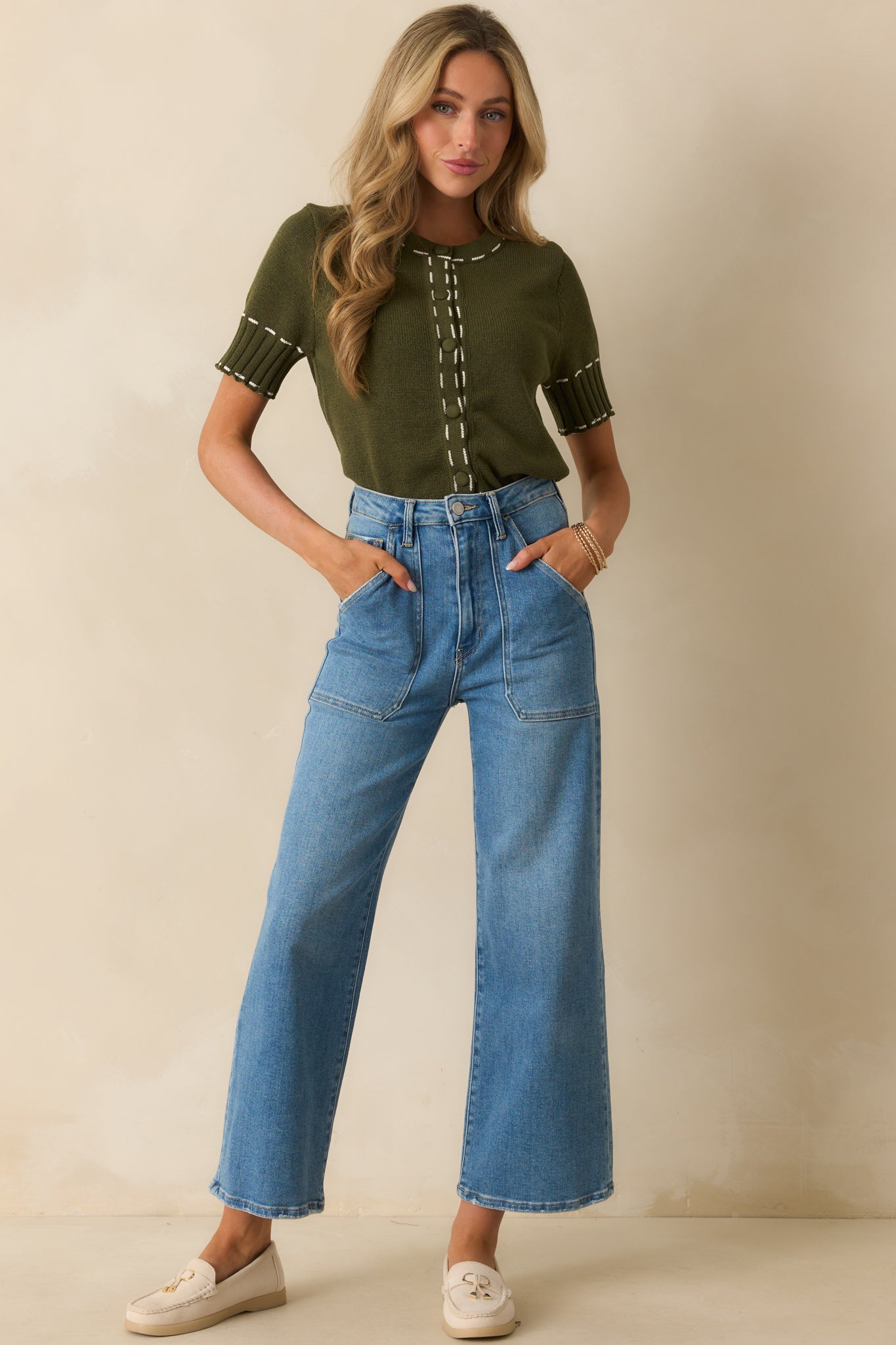 Olive green cardigan with a crew neckline and short sleeves.