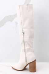 Inside view of white boots with an inside zipper closure. 