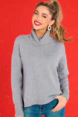 Front view of  this sweater that features a chunky cowl turtleneck neckline.