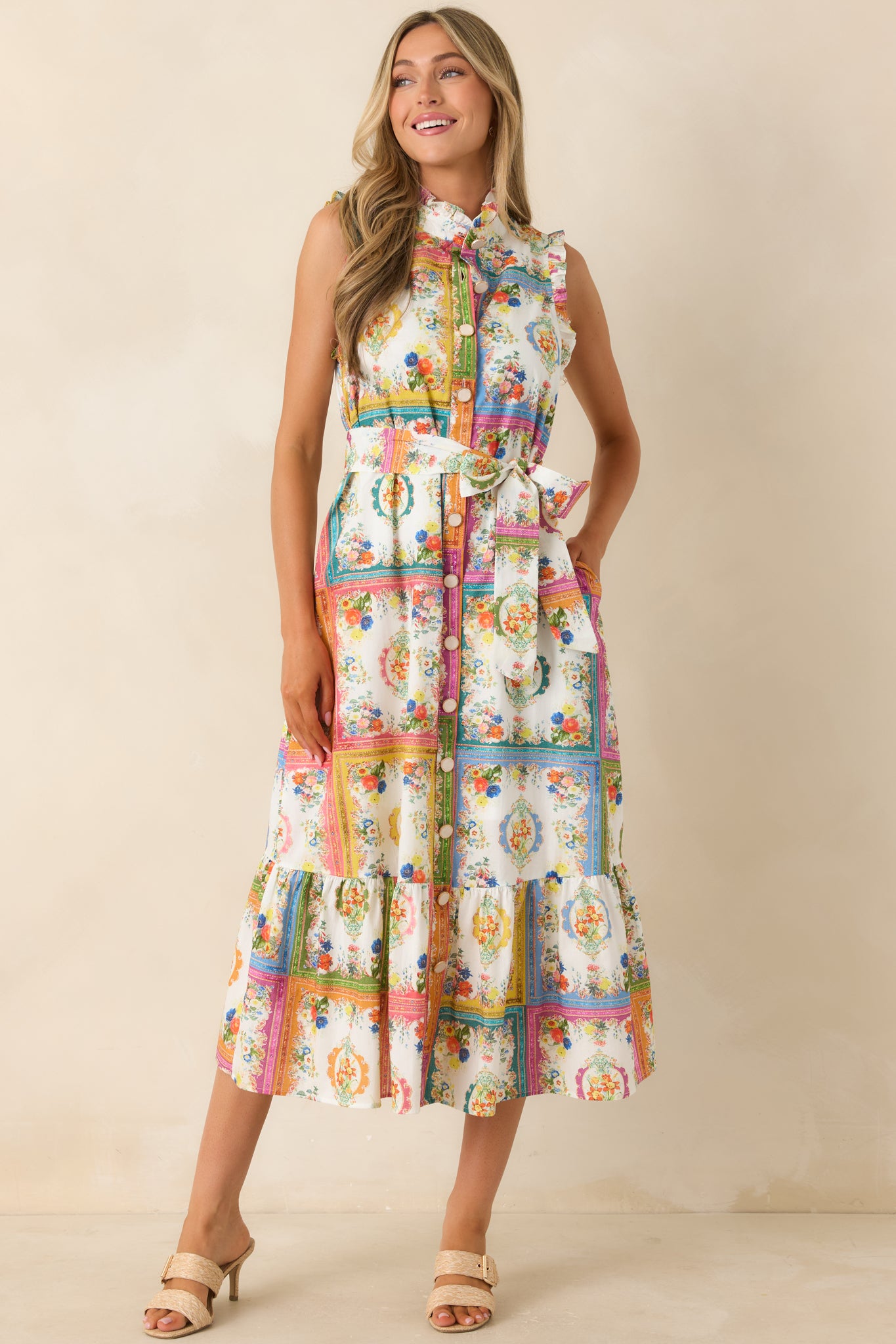 Floral tile print dress with removable waist tie and softly structured midi-length silhouette.