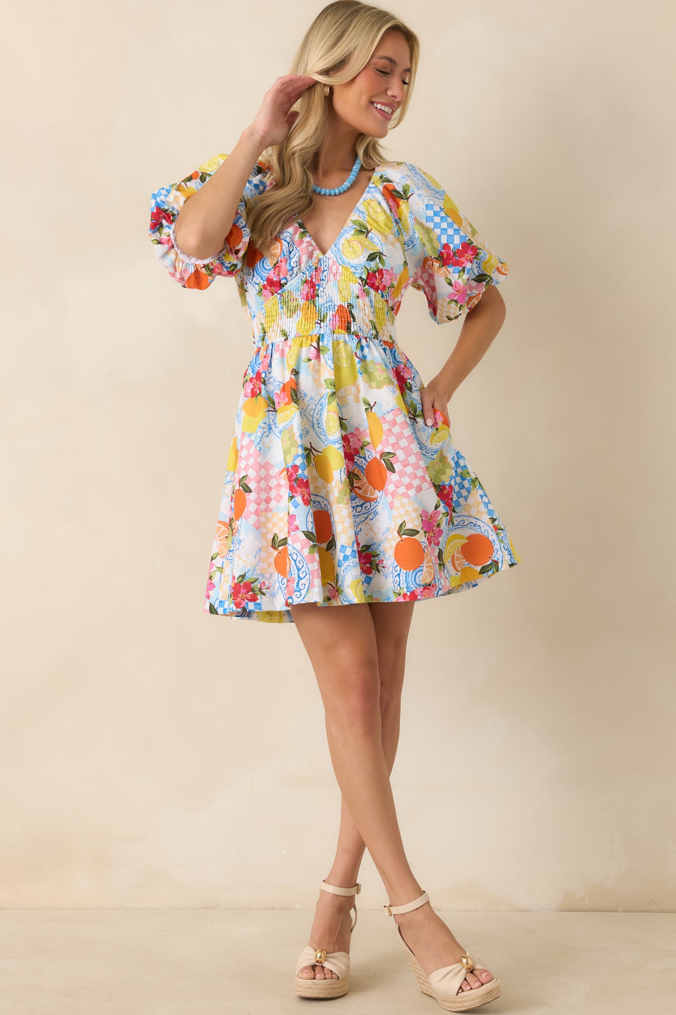 Mini dress with a lightweight, easy drape skirt featuring an allover citrus motif in bright, cheerful tones.