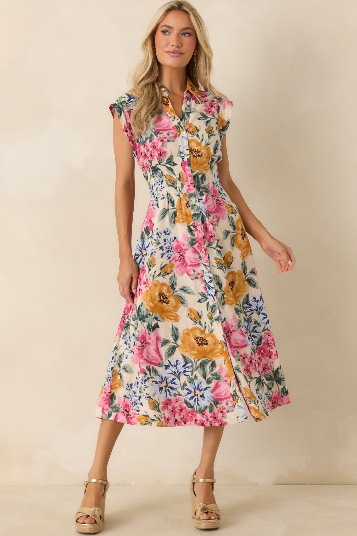 Floral midi dress in ivory tones with cap sleeves, a structured collared neckline, and a softly tailored fitted waist for a clean silhouette.