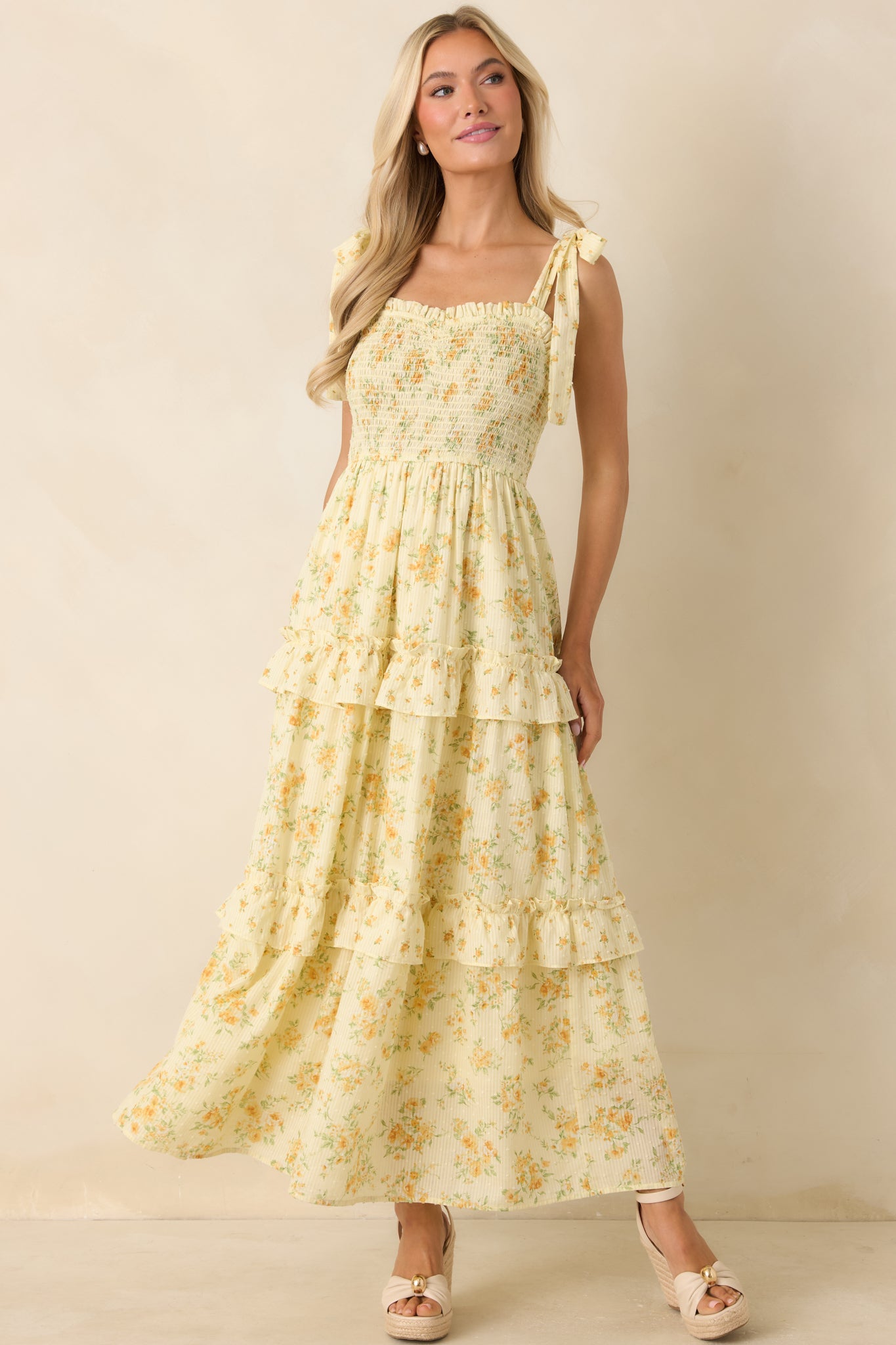 Floral cotton midi dress with Swiss dot texture, smocked bodice, and sweetheart neckline.