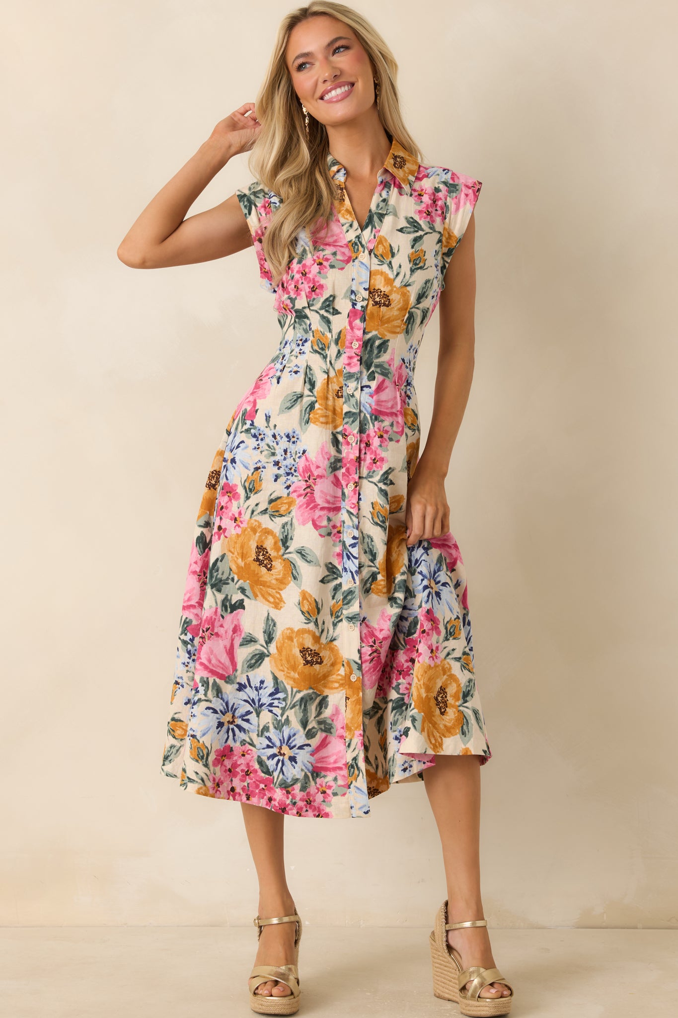 Ivory multi floral midi dress in a linen-rayon blend featuring a collared neckline, fitted waist, and full-length button-front closure with an allover floral print.