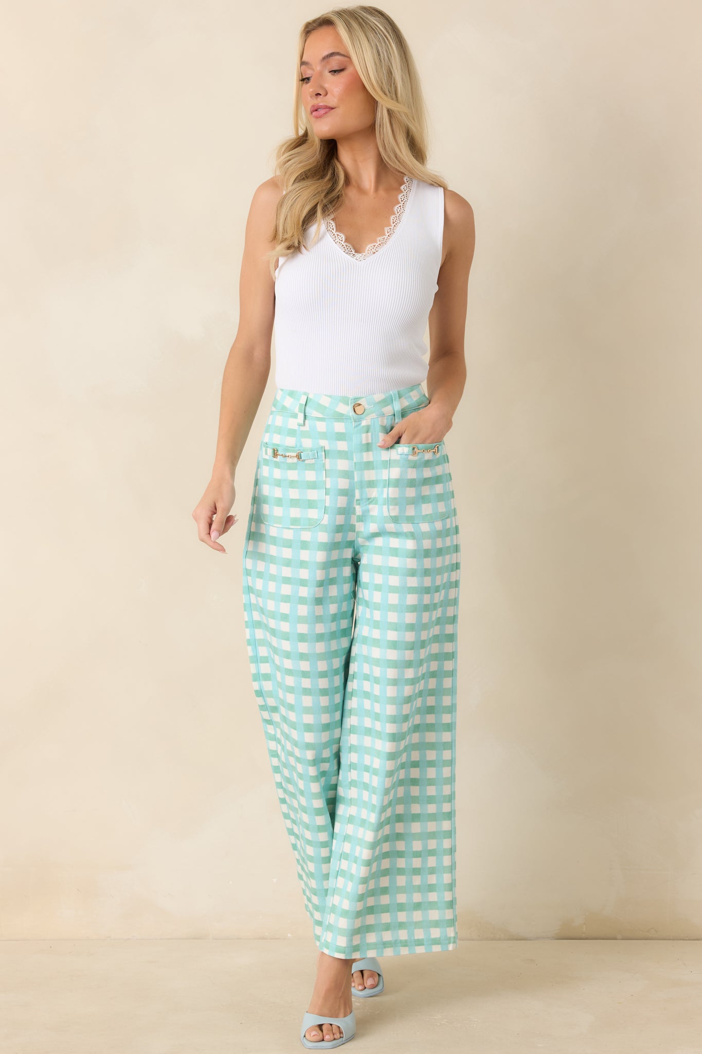 Structured cotton gingham pants featuring a flattering high waist, belt loops, and a relaxed wide-leg silhouette.