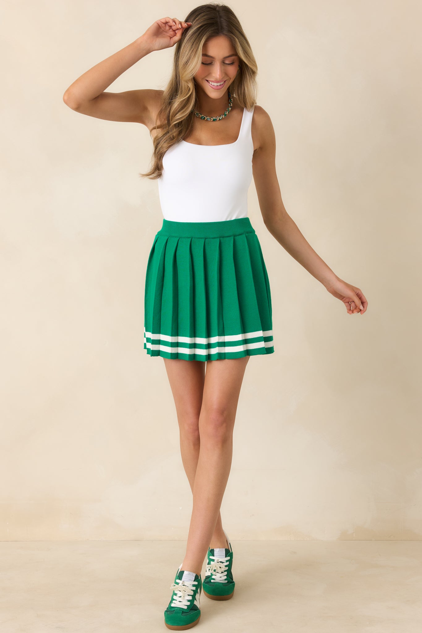 Full body view highlighting the fitted stretch fabric and clean, minimal design of the bodysuit.