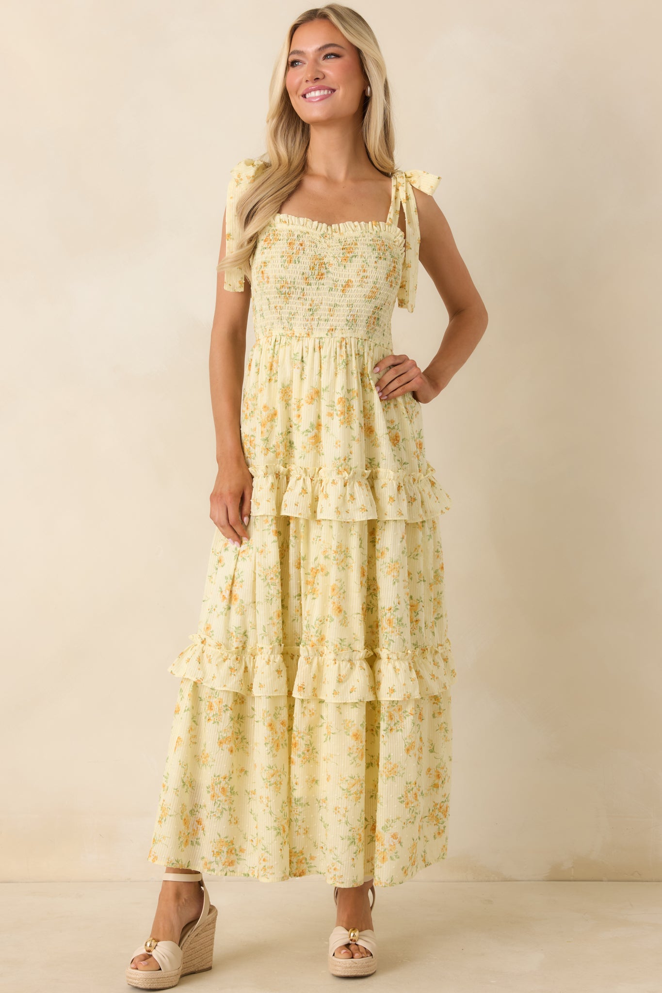 Floral midi dress with sweetheart neckline and airy tiered ruffles for added movement.