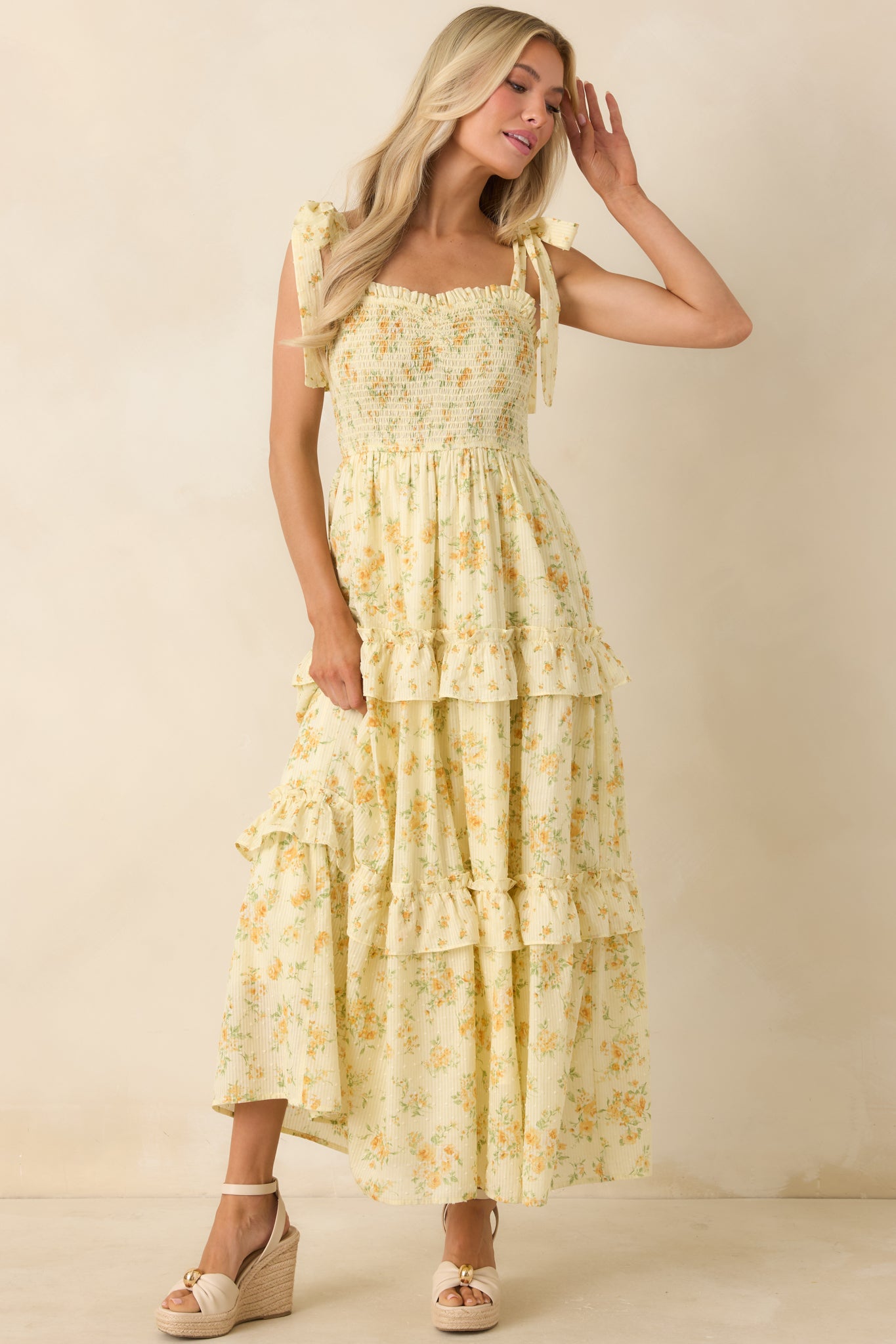 Swiss dot textured cotton midi dress with feminine floral print and relaxed flow.