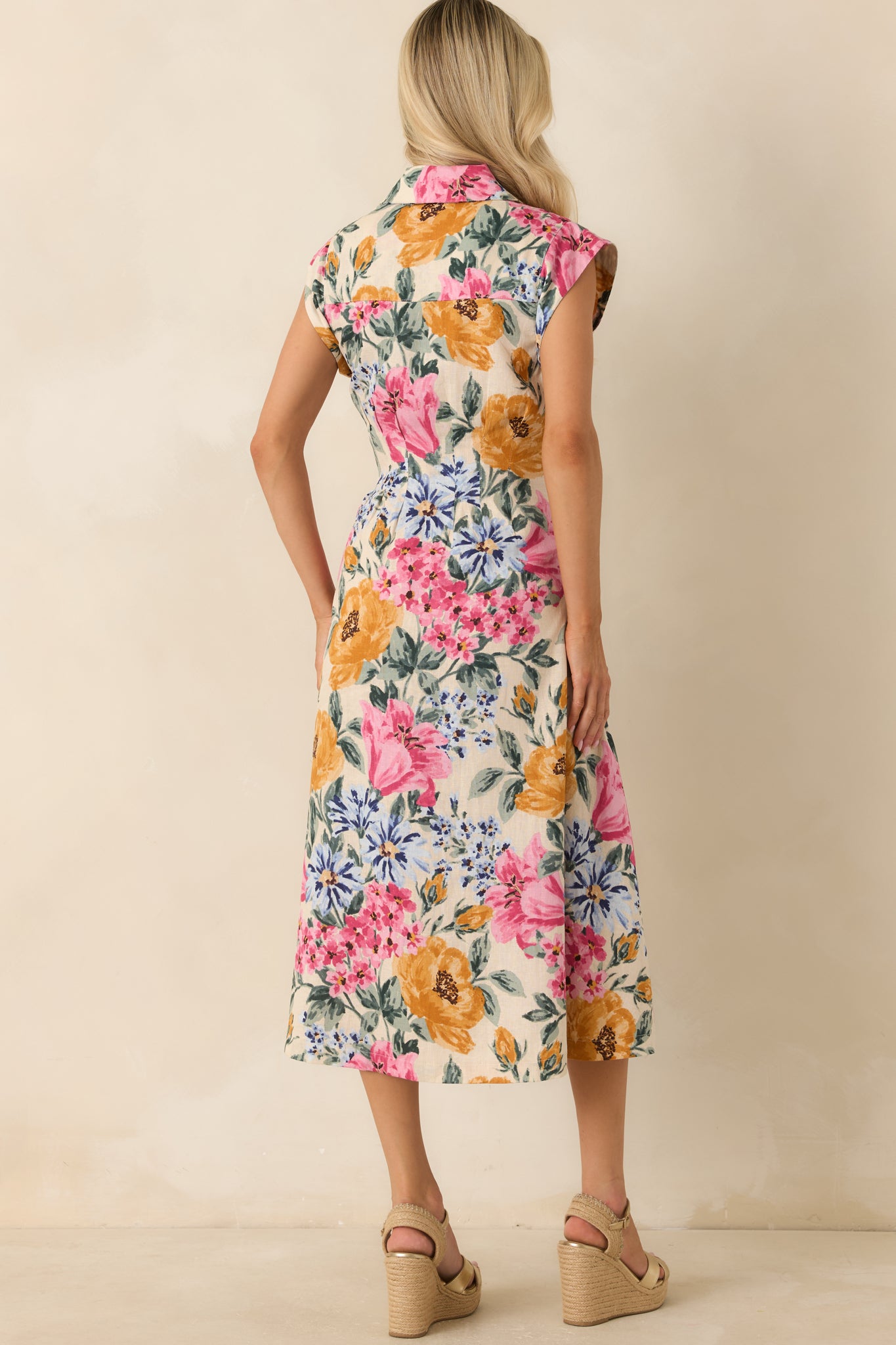 Ivory multi floral midi dress from the rear, showing a smooth continuous floral print and a clean, tailored finish through the back silhouette.