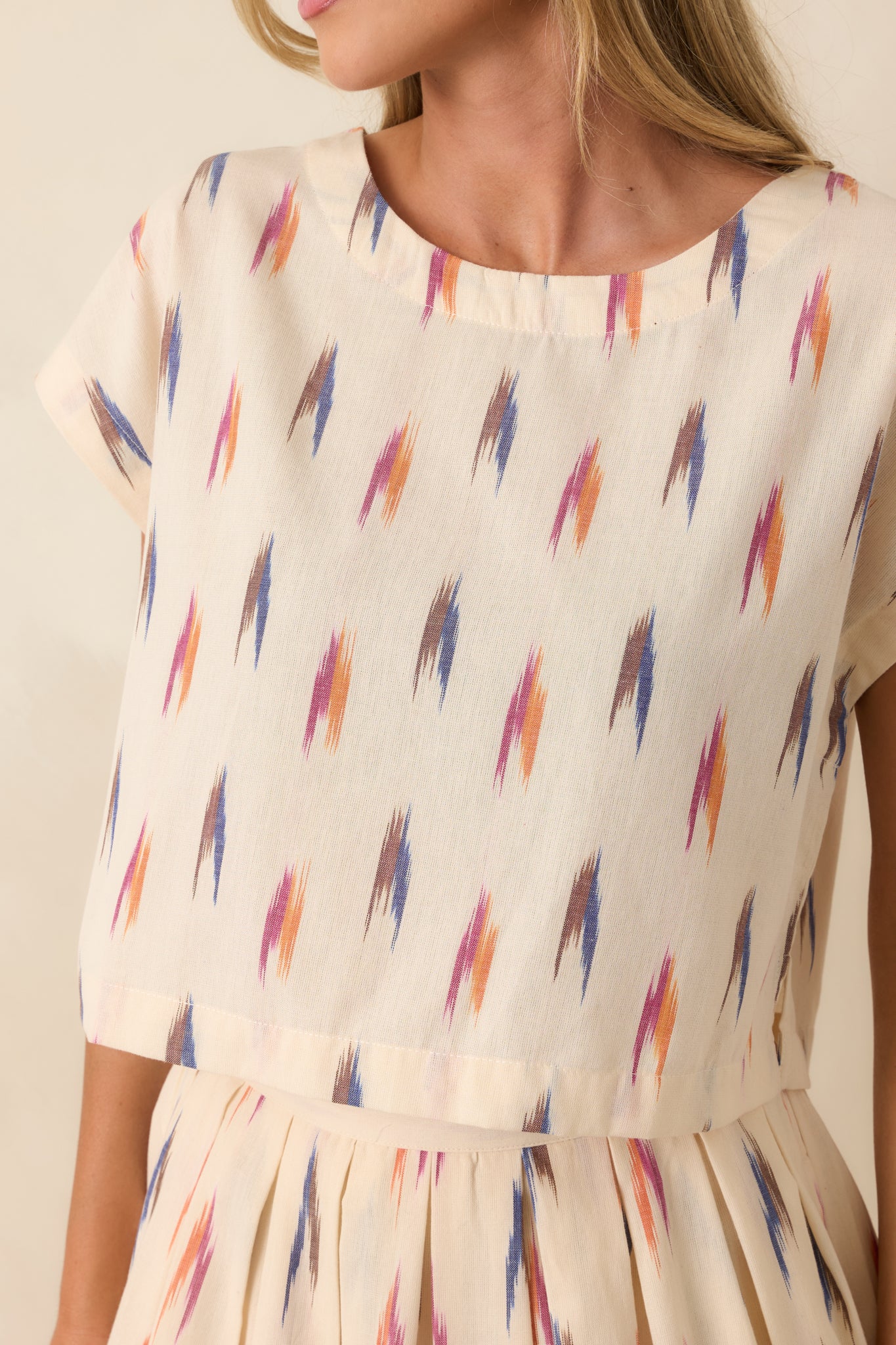 Colorful abstract print on lightweight ivory cotton with artistic brushstroke-inspired details.