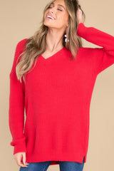 This red sweater features a v-neckline and an oversized look.