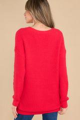 Back view of this sweater that features an oversized look and knit pattern.