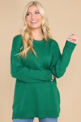 Front view of this sweater that features a round neckline and ribbed detailing around the neck and cuffs.
