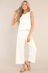 These white pants feature a high waisted design, an elastic waistband, ribbed terry cloth, and a slightly cropped hemline.