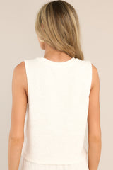 Back view of  this tank top that features a crew neckline, a super soft terry cloth fabric, ribbed texturing, and a split hemline.