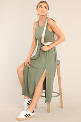 This green dress features a scoop neckline, an elastic waistline, hip pockets, 2 front slits, and a super soft material. 