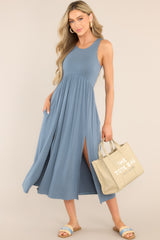 This blue dress features a scoop neckline, an elastic waistline, hip pockets, 2 front slits, and a super soft material. 
