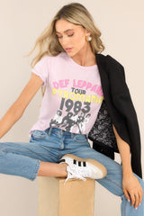 Full body view of this top that features a crew neckline, dropped shoulders, a Def Leppard graphic, and short sleeves.