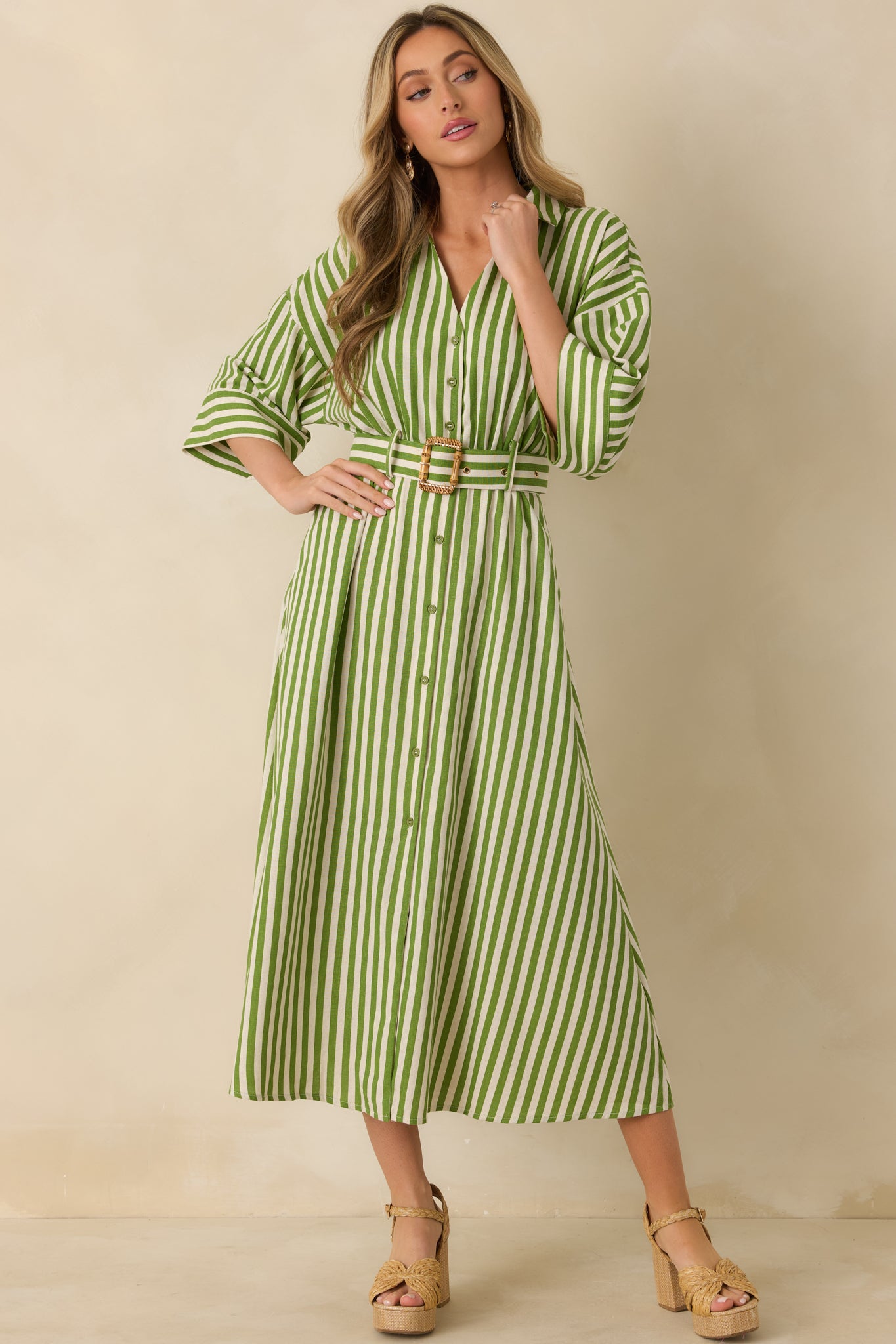 Green striped maxi shirt dress showcasing smooth vertical stripes and an effortlessly draped, comfortable fit