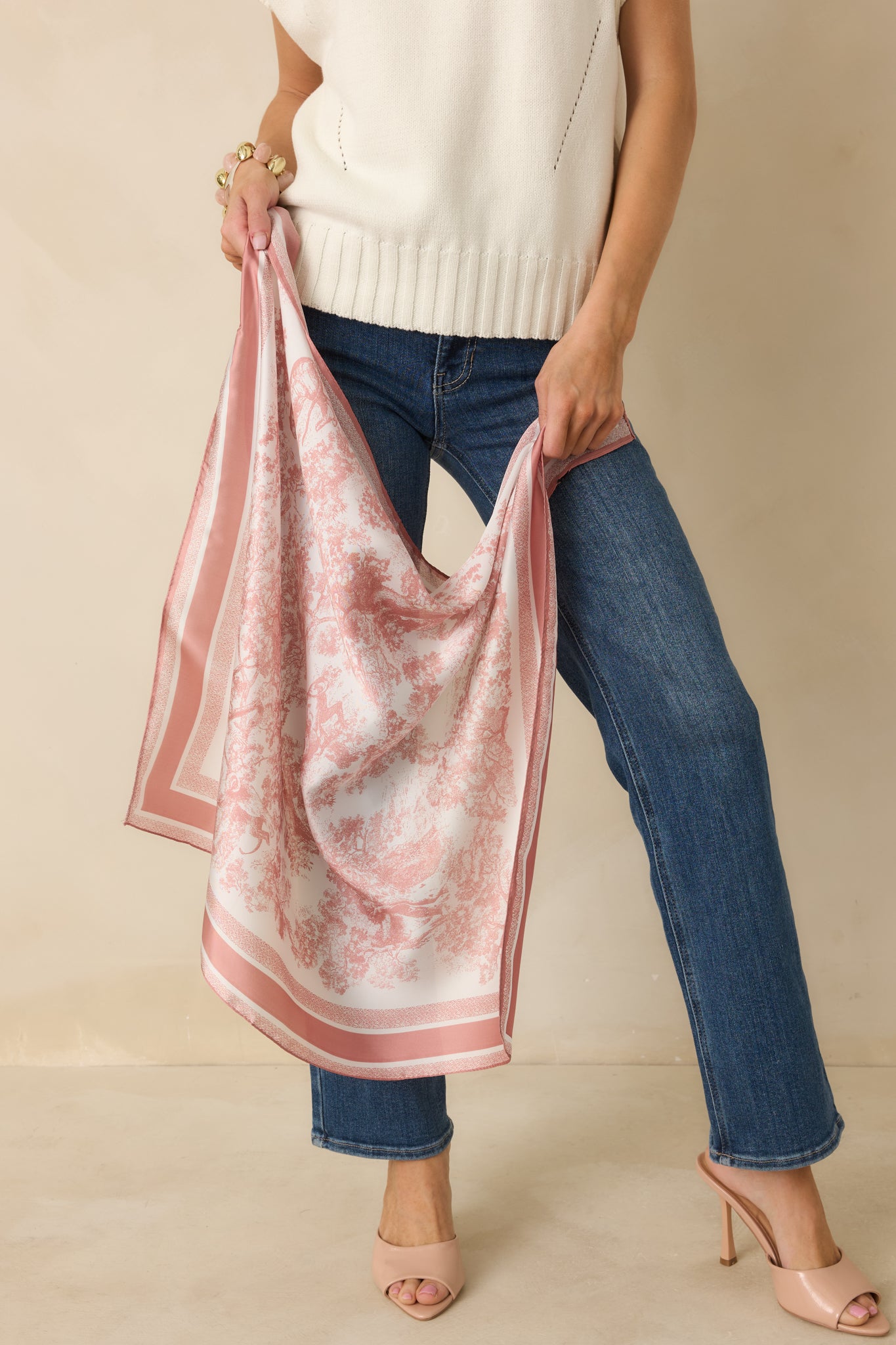 Angled view of the lightweight woven scarf emphasizing the square silhouette and allover jungle print.