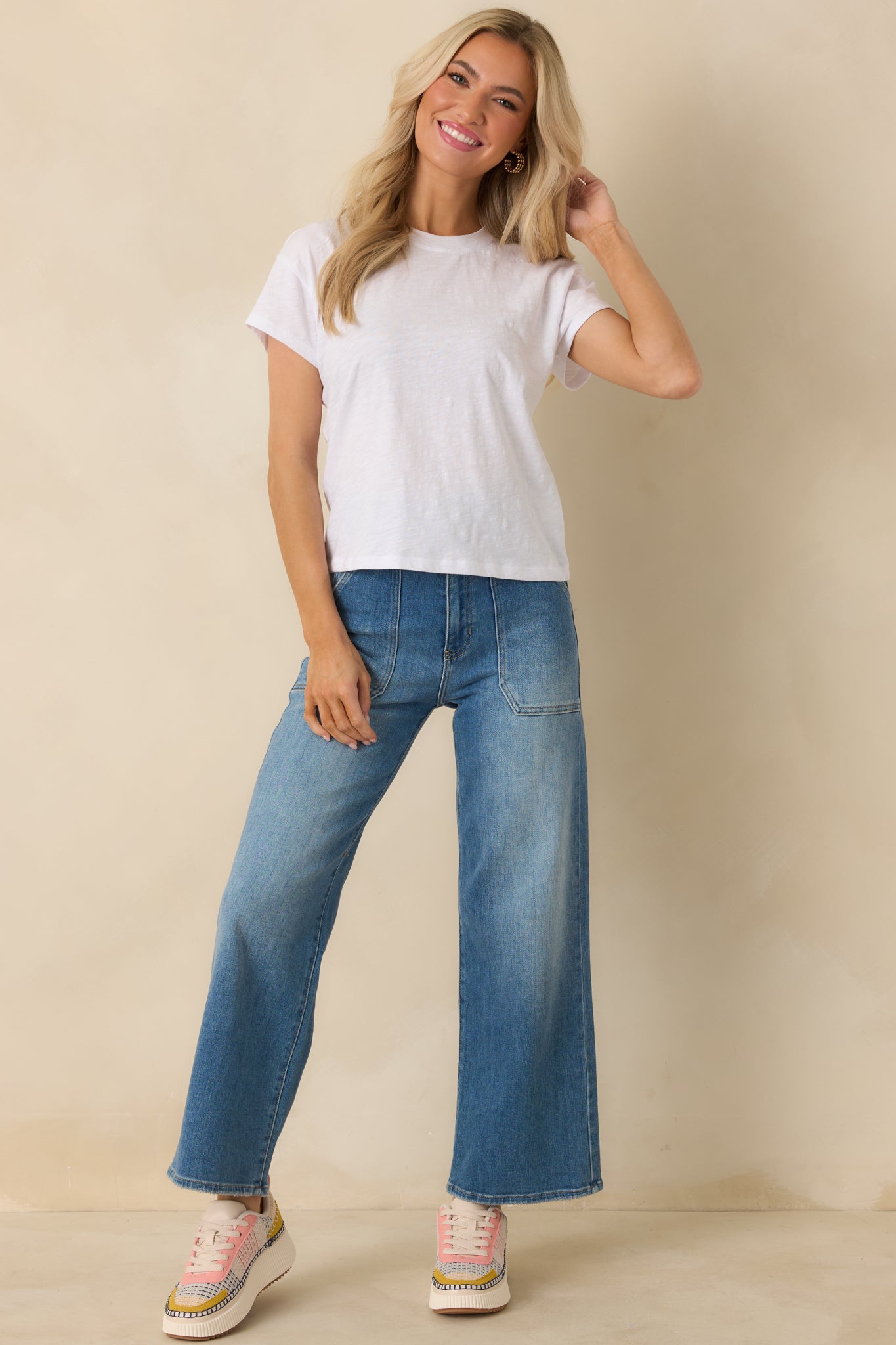 Front view of white T-shirt featuring soft brushed slub jersey fabric and classic crew neck.