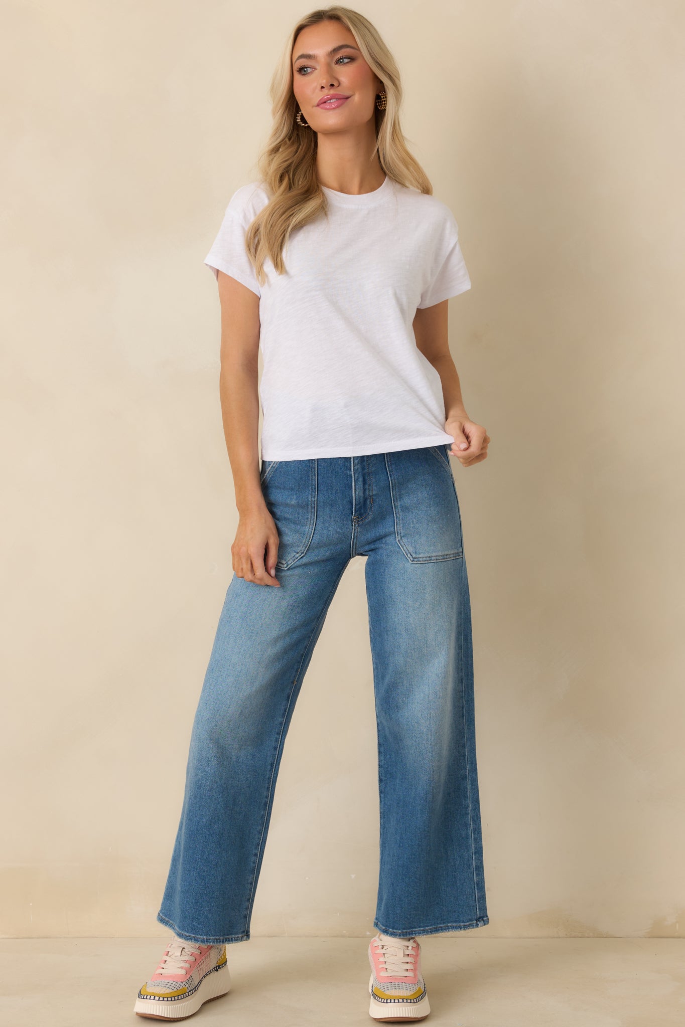 White short sleeve tee with relaxed fit and lightweight cotton texture.