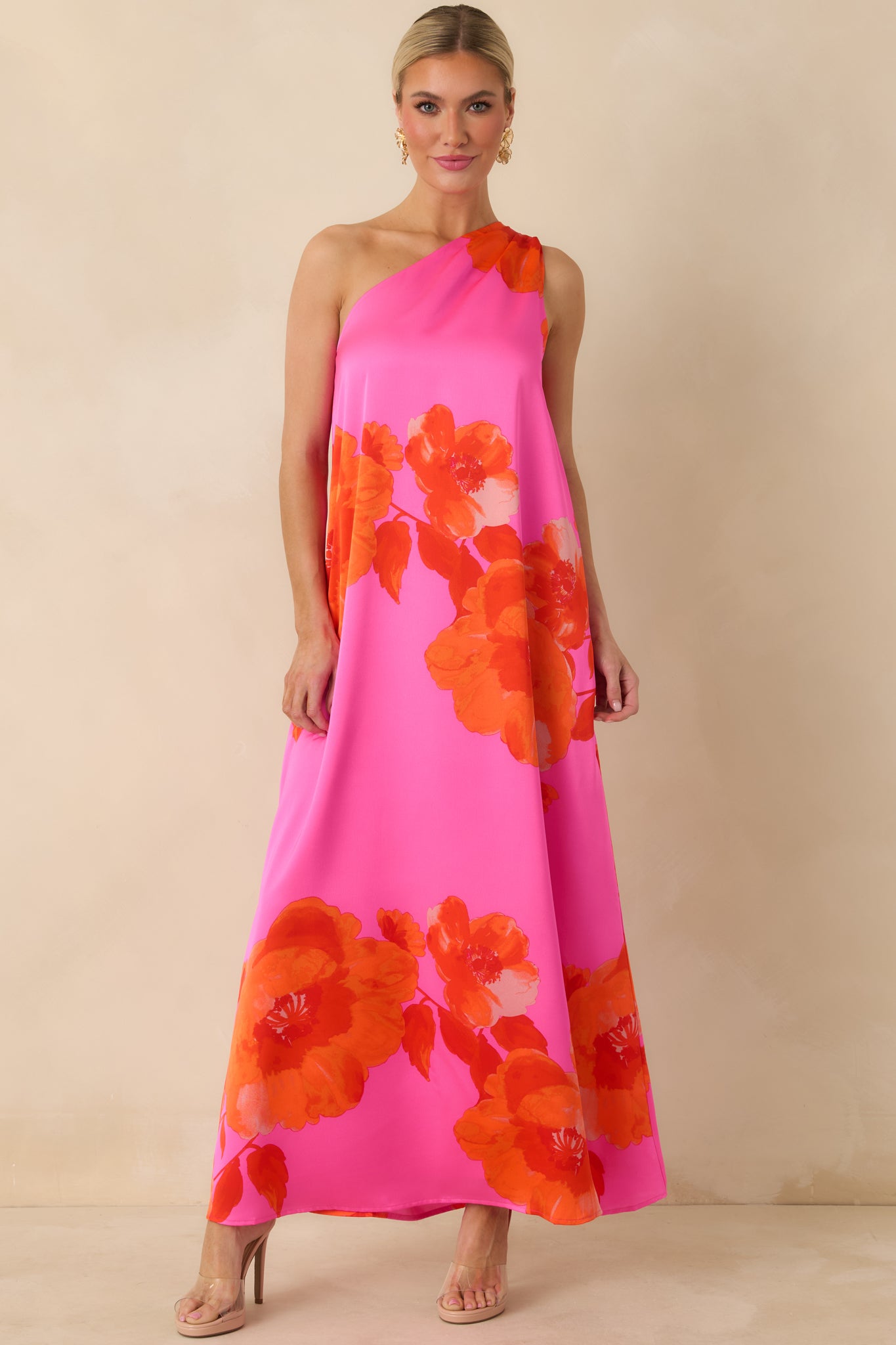 Satin pink maxi dress with red floral print and a smooth, polished drape for a relaxed fit.