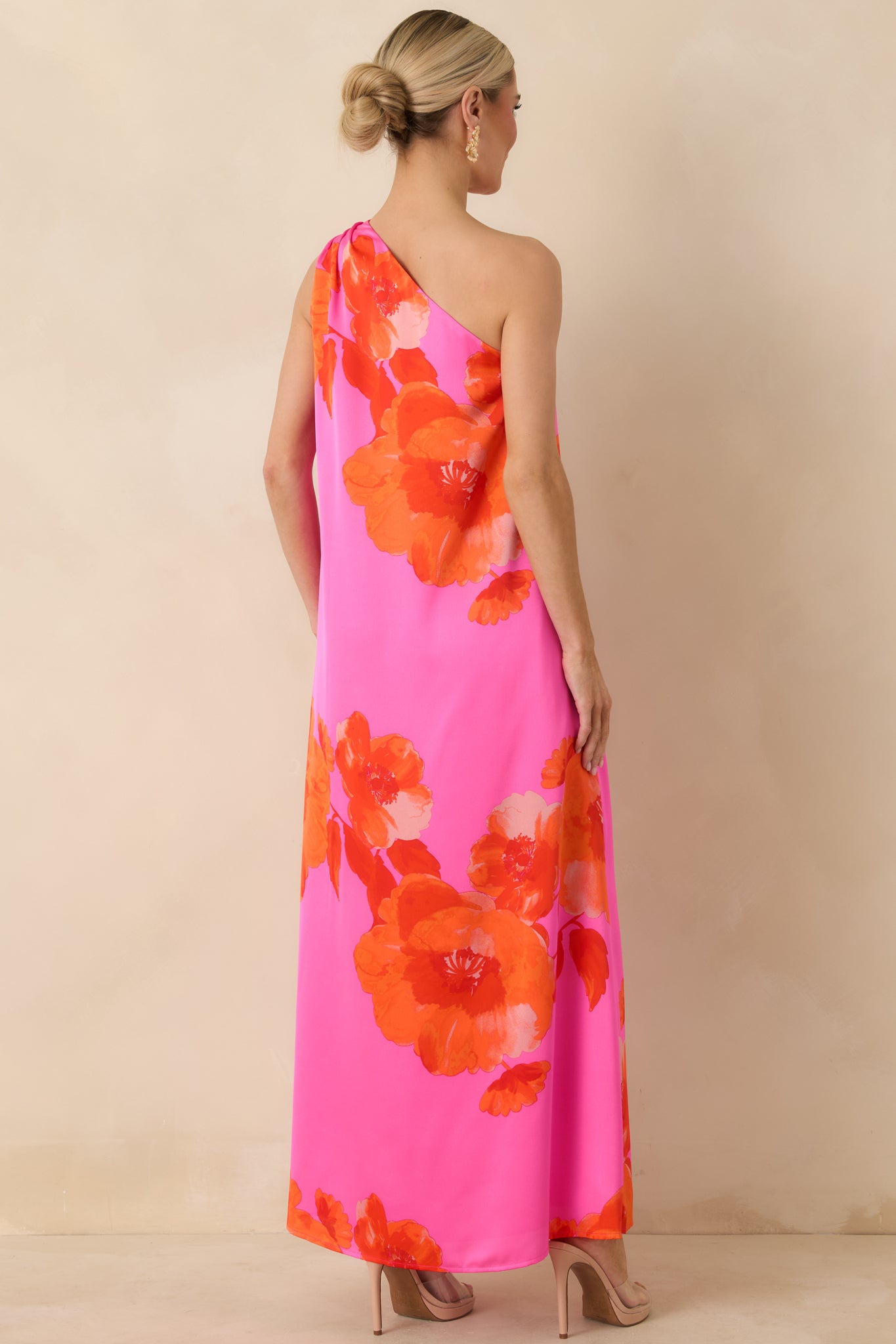 Rear view of the pink floral maxi dress showing the flowing satin fabric and fully lined construction.