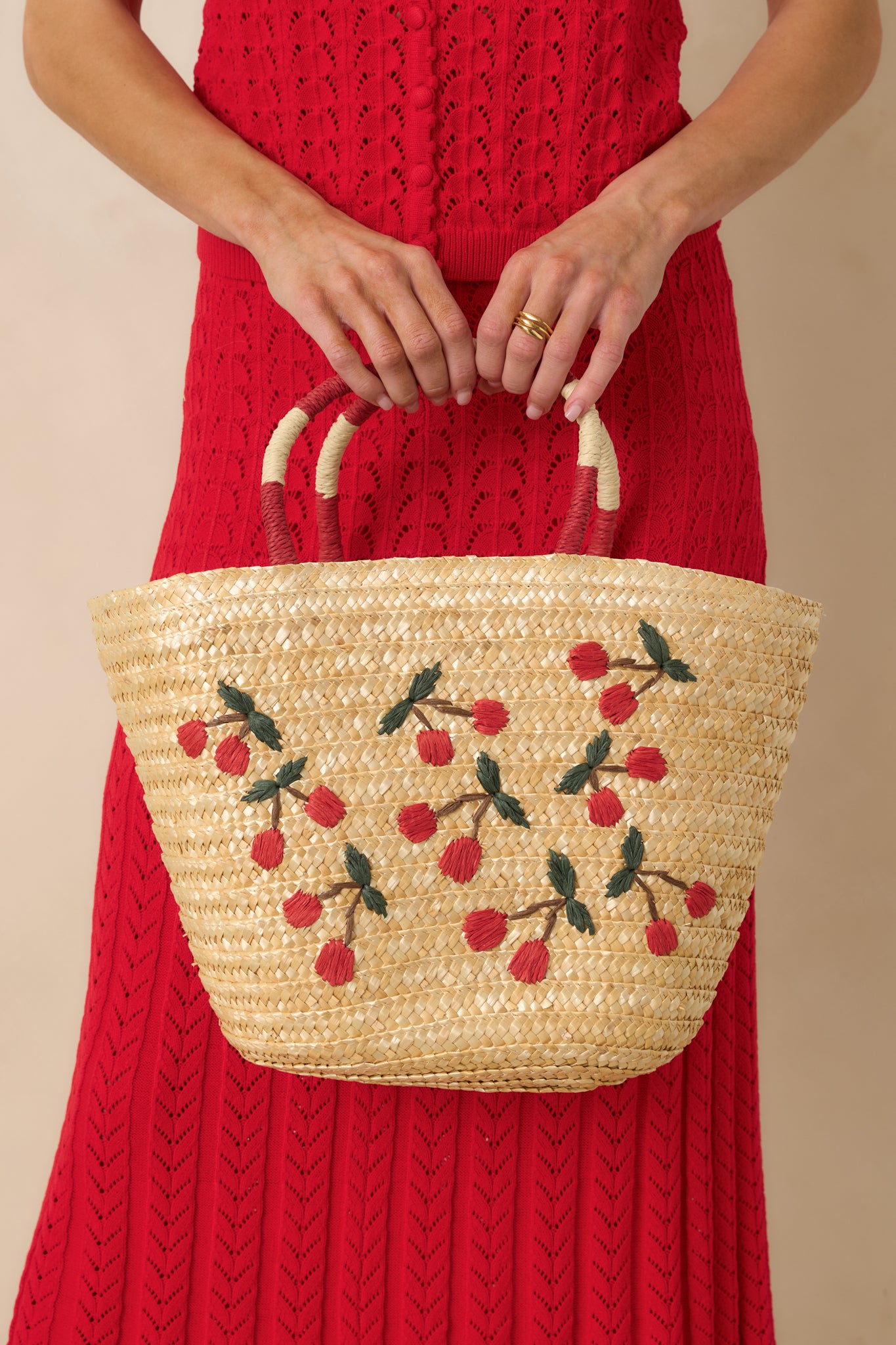 Close cropped angle showing the texture of the straw and colorful handle detailing.